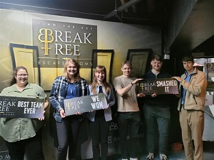 James Mallord,Pippa Baugh and Isobel Sargeant and Lucideon staff in escape room